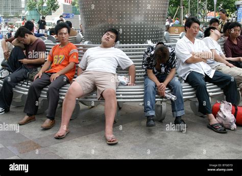 Sleeping Chinese On A Street Of Shanghai People Take A Nap Anywhere