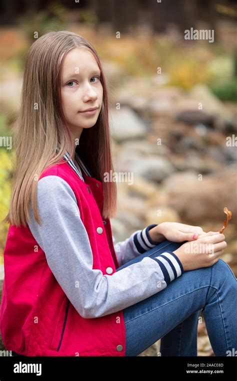 Teen girl una nature. Vertical portrait of a ten year old girl Stock ...