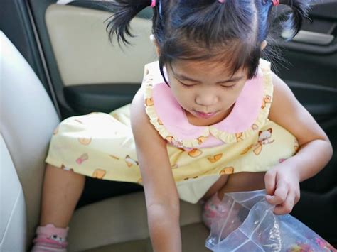 Premium Photo Rear View Of Cute Girl Sitting In Car