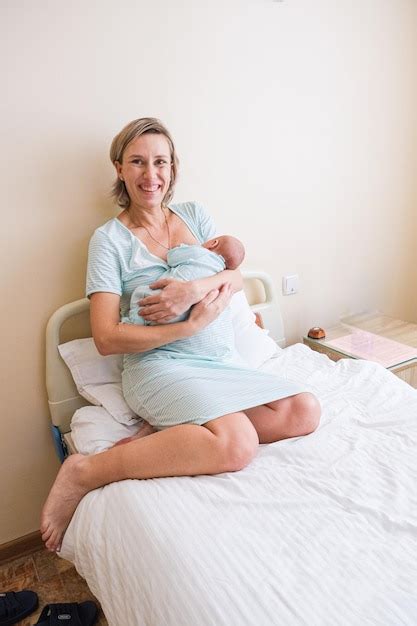 Premium Photo Newborn Baby Sleeping In Hospital Bassinet With Mom