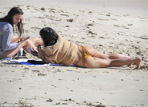 Olympia Valance flaunts her pert derrière in bikini in Byron Bay