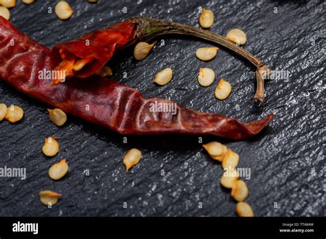 Dried Mexican Red Chile De Arbol Pepper on black natural stone ...