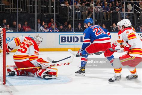 Jacob Markstrom Of The Calgary Flames Makes A Save Against Chris