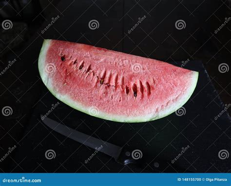 Watermelon Slice on Dark Black Background Stock Photo - Image of ...