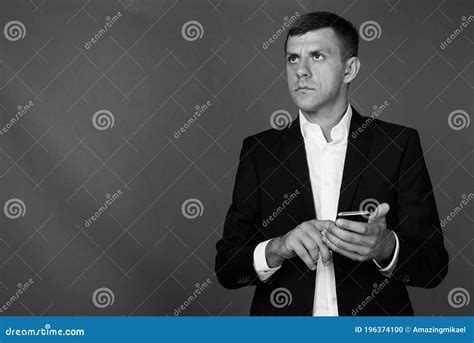 Handsome Businessman With Short Hair Against Gray Background Stock