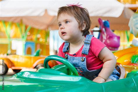 beautiful girl on the ride car Stock Photo | Adobe Stock