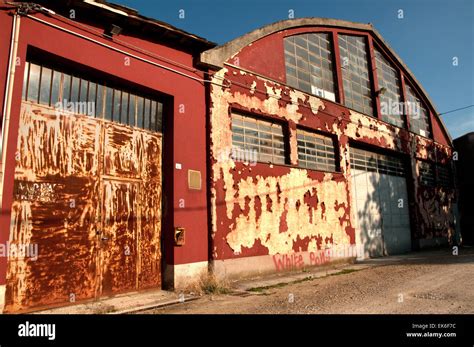 Old Factory With Scraped Walls Rusty Door And Wall Graffiti Lugo Ra