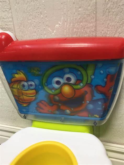 Kolcraft Sesame Street Elmo Adventure Potty Training Chair With Toilet