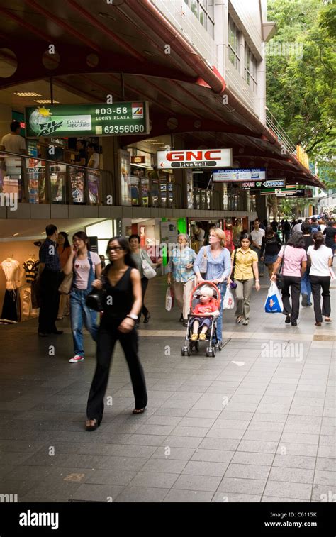 Shoppers at Lucky Plaza shopping mall, Orchard Road, Singapore Stock ...