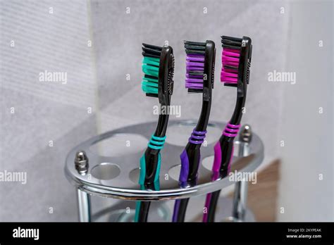 Toothbrushes Stand In A Special Stand In The Bathroom Interior Stock