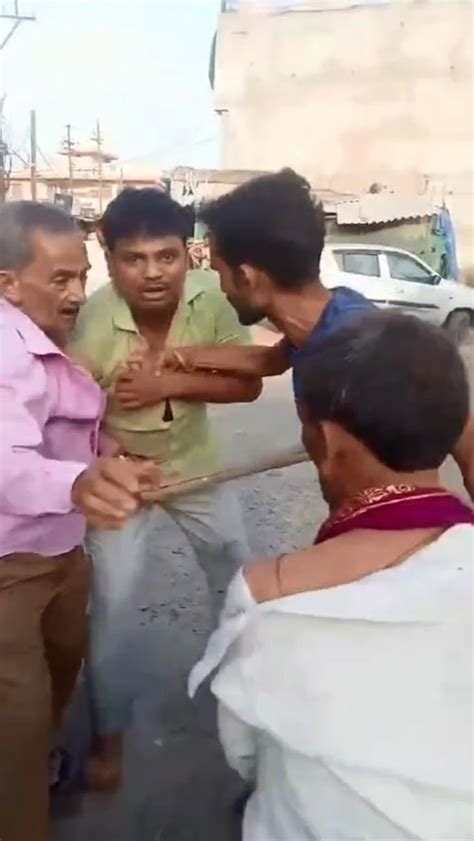 Sticks Fight Between Two Parties In The Middle Of The Road Video Goes