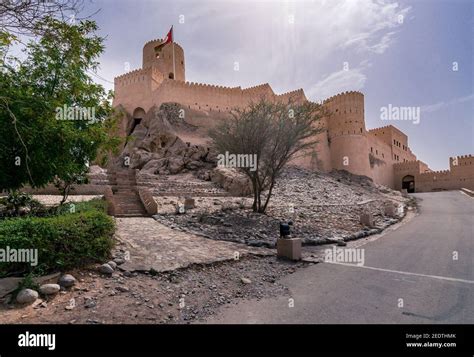 Walls of medieval arabian fortress in Nakhal, Oman. Hot day with haze ...