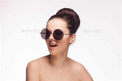 Pretty Woman Naked Shoulders And Sunglasses Light Background Fashion