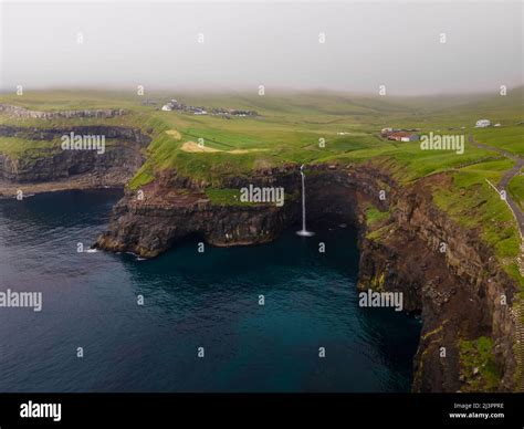 Beautiful Aerial View Of Gasadalur Waterfall And Village And Landscapes