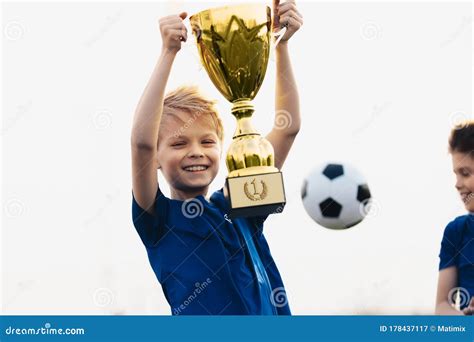 Happy Boy Rising Golden Trophy. Child Winning Sports Competition ...