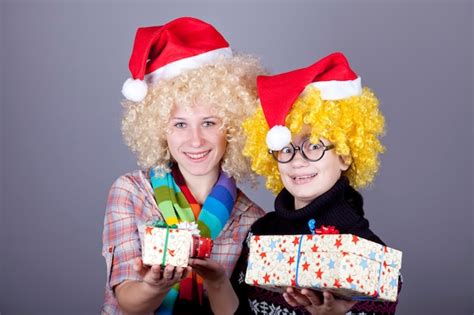 Premium Photo | Two funny girls with christmas gifts.