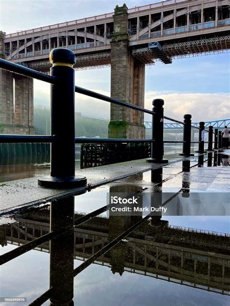 The High Level Bridge And Bollards And Railings Reflected In A Still