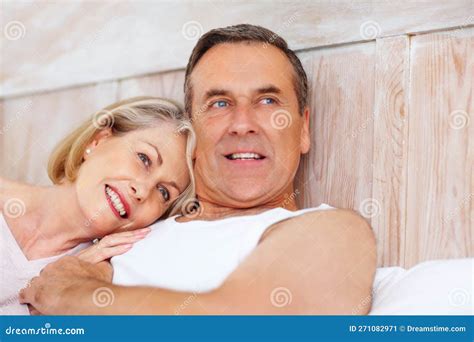 Smiling Mature Woman Resting On Husbands Chest Closeup Portrait Of A