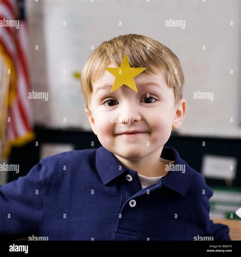 boy with gold star Stock Photo - Alamy