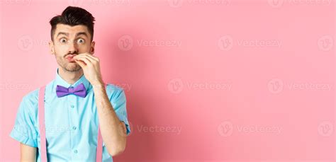 Image of funny guy with moustache and bow-tie showing chefs kiss