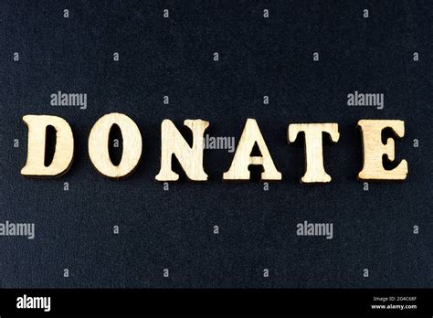 Donate Wooden Letters On The Office Desk Informative And