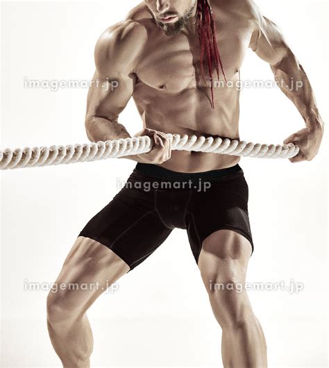 Muscular Man Working Out With Heavy Ropes Photo Of Sporty Male With