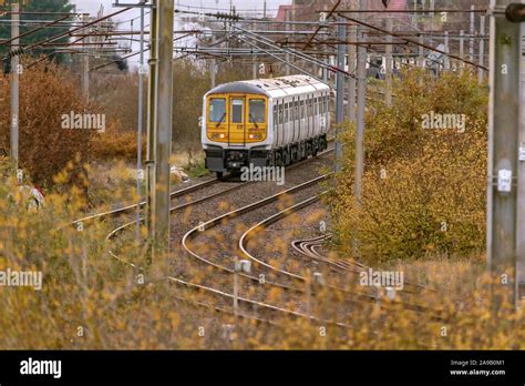 British Rail Class 319 Is A Dual Voltage Electric Multiple Unit Train At Winwick Junction Stock