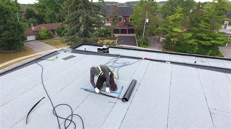 Installing Soprema Flat Roof Modified Bitumen System On Modern Home In