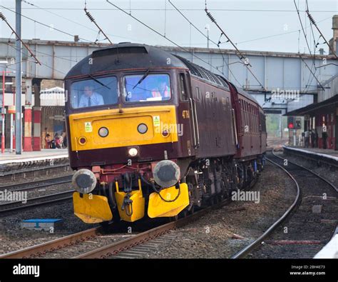 West Coast Railways Class 47 Diesel Locomotive 47760 Passing Lancaster With A Train Of Empty