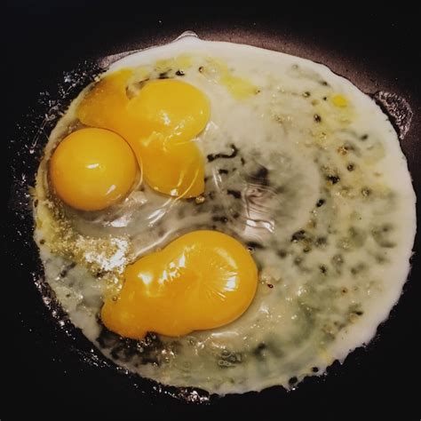 Premium Photo Close Up Of Egg Cooking In Frying Pan