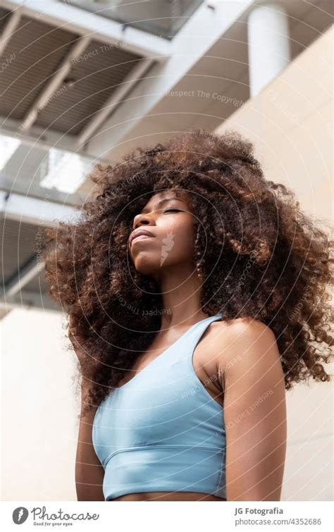 Young Black Woman Closed Eyes With Curly Hair Style A Royalty Free