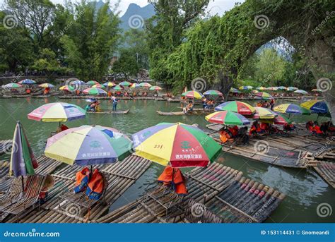 Bamboo Rafting On The Yulong River Editorial Photo Image Of Umbrella