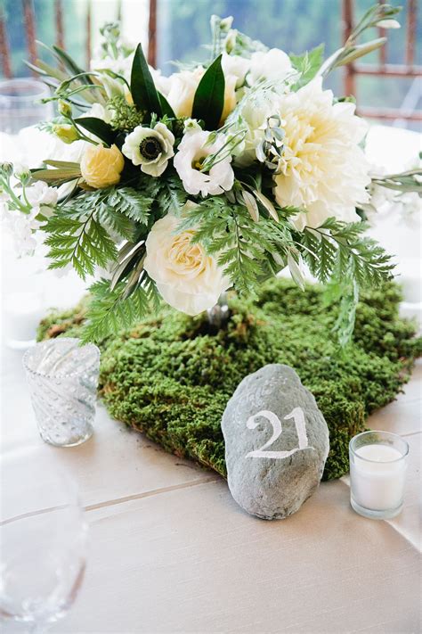 Natural Centerpieces Made With Moss And Rock Table Numbers Moss