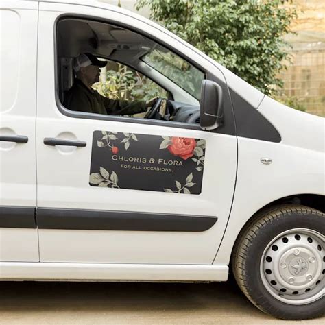 a white van is parked on the side of the road with its driver in it's seat