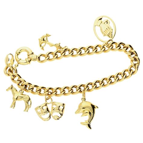 9ct Gold Charm Bracelet With 6 Charms 196 Grams Miltons Diamonds