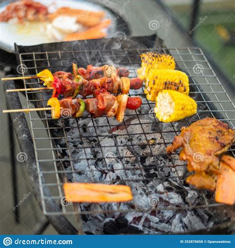 Delicious Grilled Meat With Smoke Bbq With Vegetables In Outdoor Barbecue Party Lifestyle