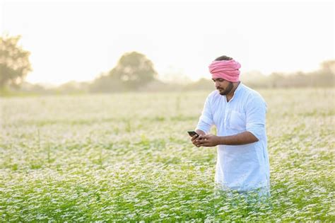 Premium Photo | Indian happy farmer harvesting coriander flowers ...