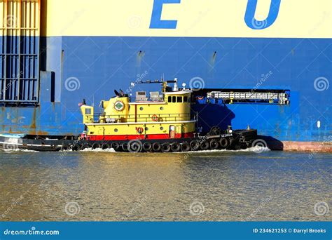 Tugboat Pushing Massive Freighter Editorial Stock Photo Image Of Boat