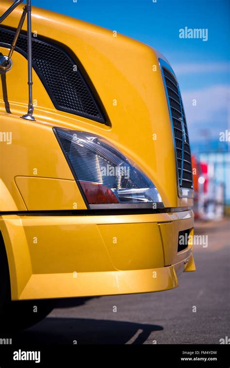 hood   yellow semi truck   modern grille headlamp  bumper