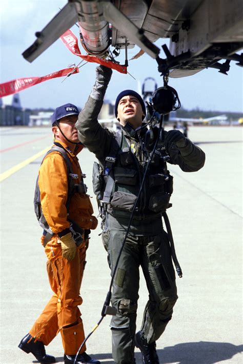 A US Air Force And A Japanese Air Self Defense Force Pilot Perform A