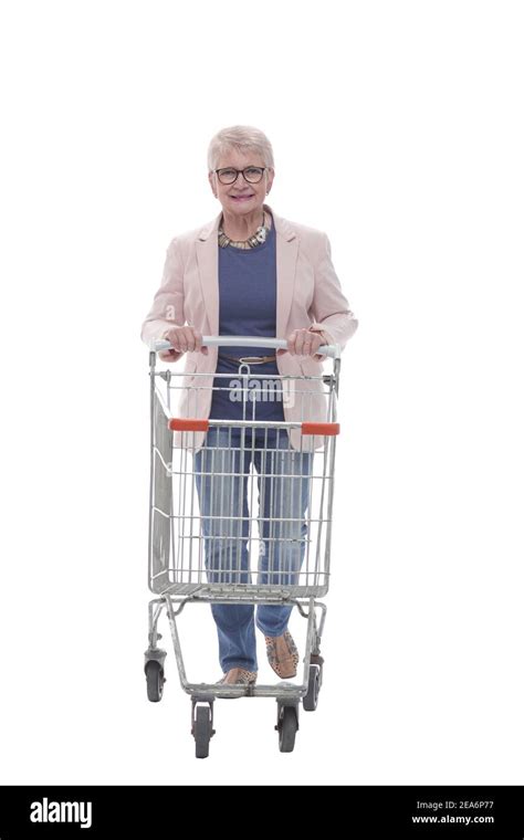 In Full Growth Happy Elderly Woman Pushing A Shopping Cart Stock Photo