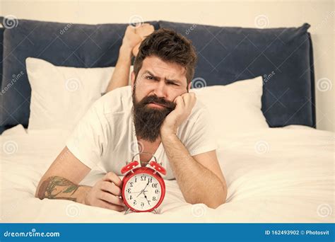 Hipster Bearded Man Lay In Bed With Alarm Clock Time To Wake Up Why