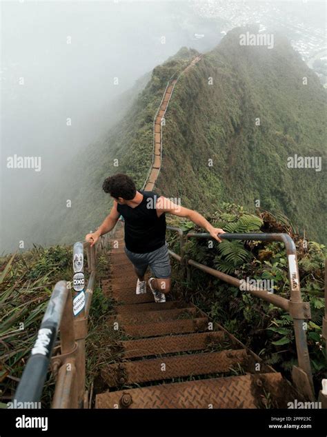 Man Hiking Stairway To Heaven Haiku Stairs On Oahu Hawaii High