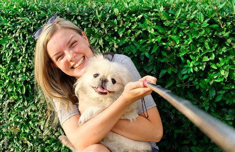 Beautiful girl with dog taken pictures of her self, instagram Stock ...