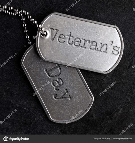 Old military dog tags - Veteran's Day Stock Photo by ©SSilver 308402816