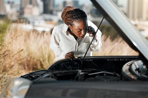 Premium Photo Phone Call Stress And Black Woman Fixing Car In The