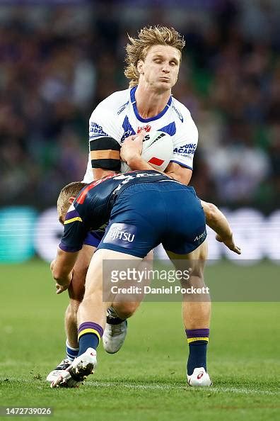 Jacob Preston Of The Bulldogs Is Tackled By Tyran Wishart Of The