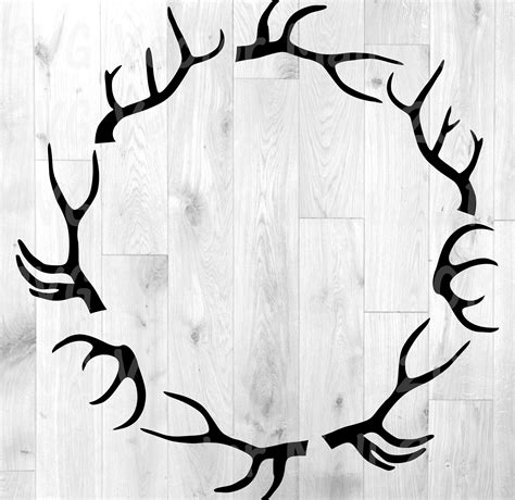 A Circle Made Out Of Antlers On Top Of A Wooden Floor