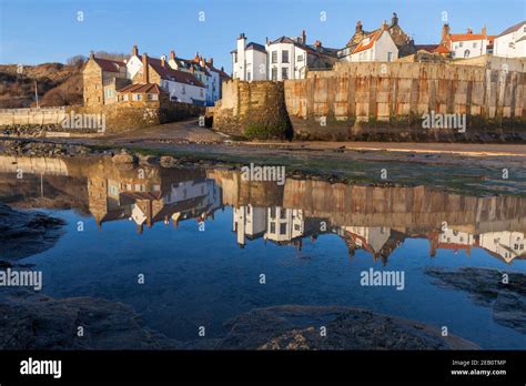 View Of The Boat Landing And Village Of Robin Hood S Bay Reflected In A