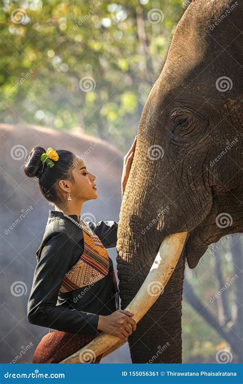 Kui`s Young Women Wearing Native Dresses Are Living With Elephants